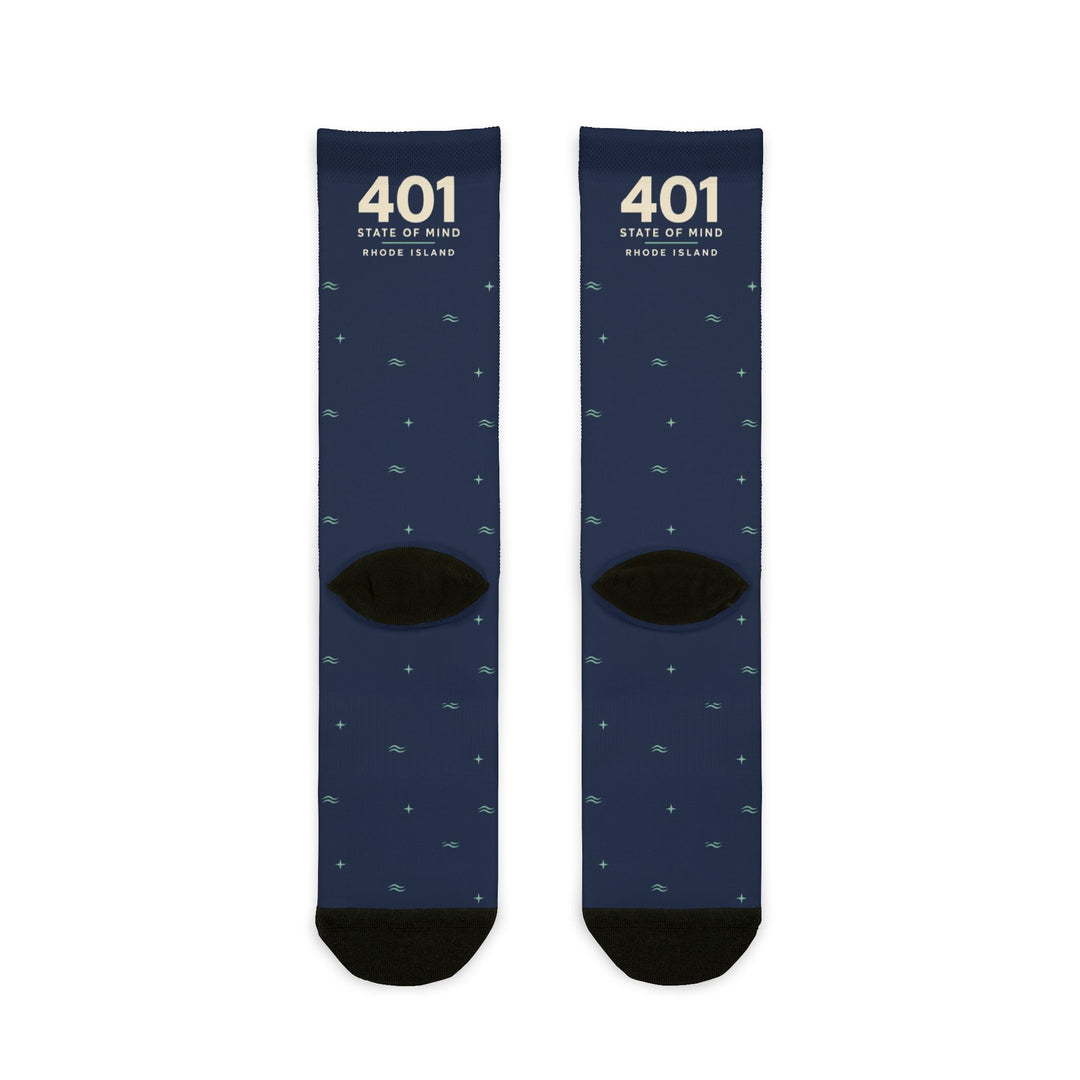 Back flat lay of navy 401 State of Mind Rhode Island crew socks showing black heels and toes