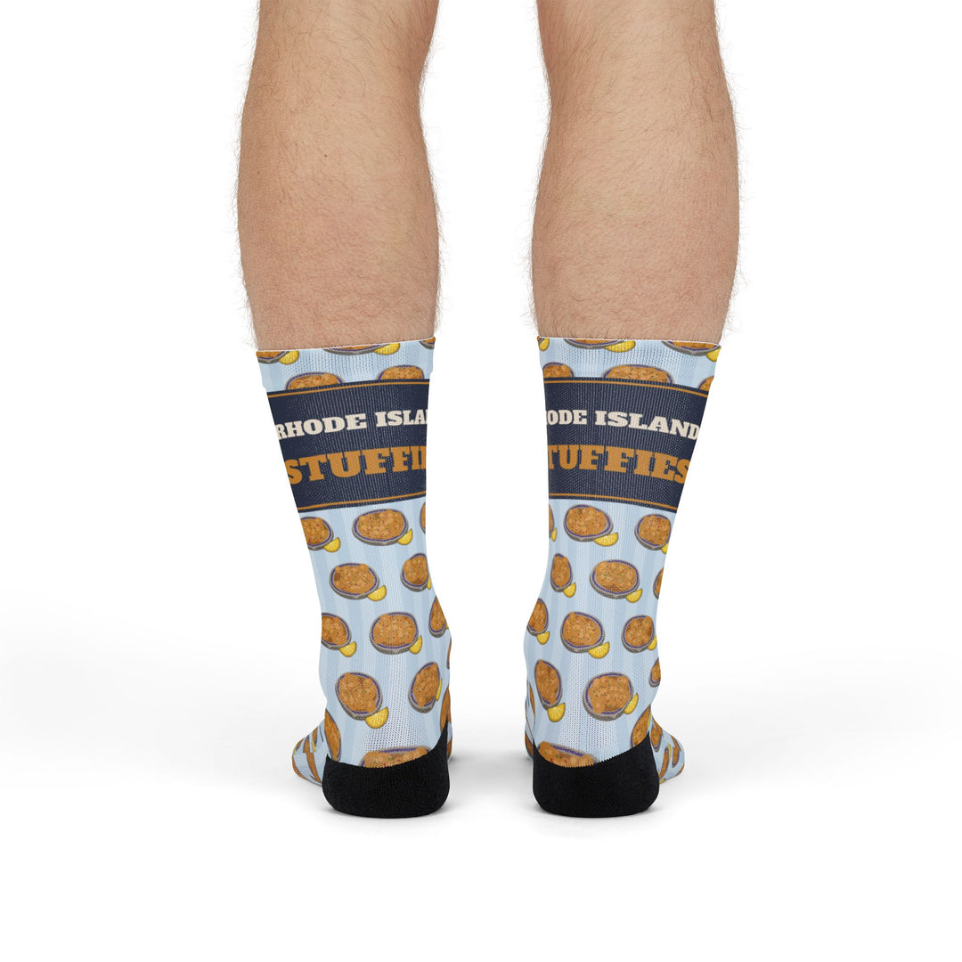 Back view of a model in the stuffie print Rhode Island socks showing black heels and blue stripes
