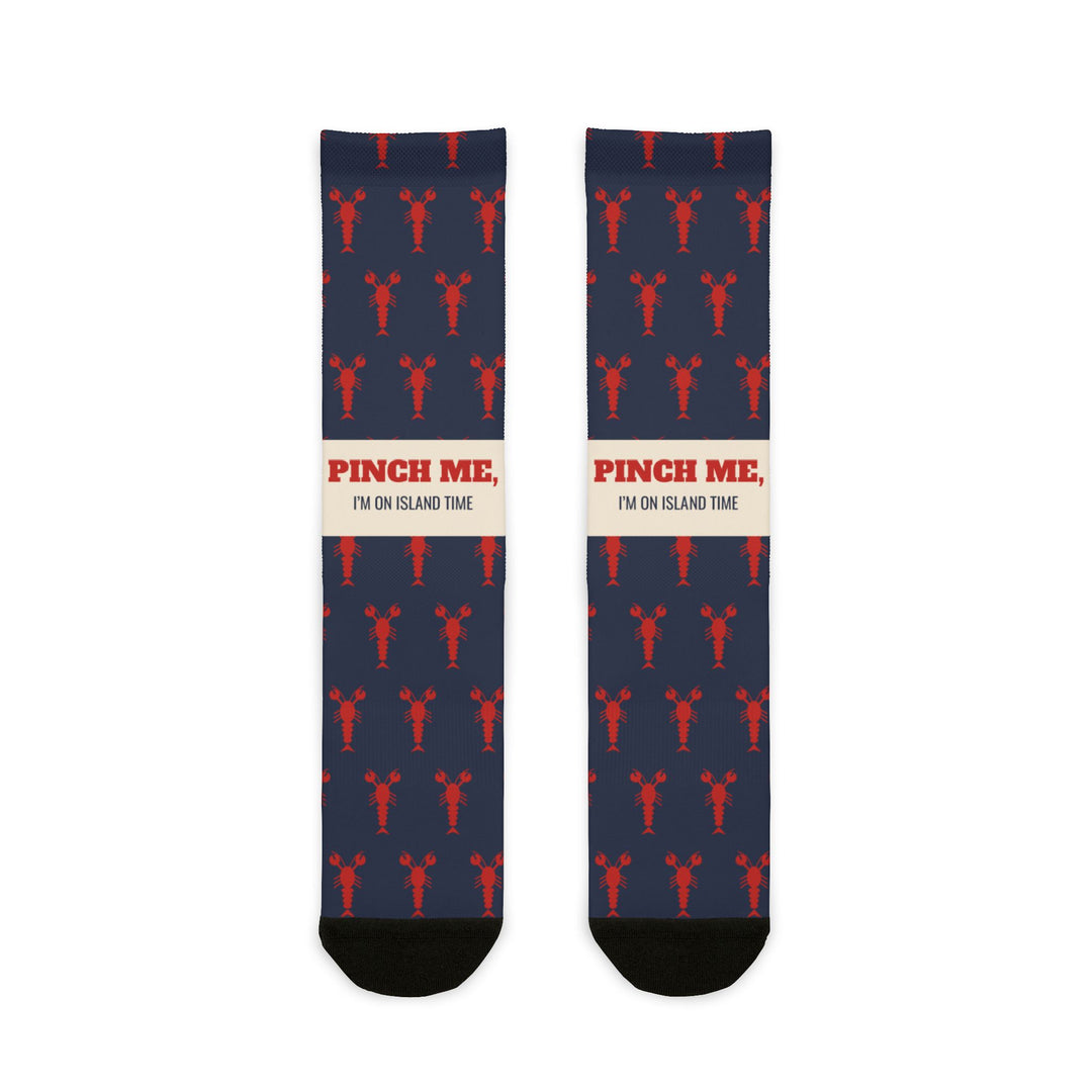 BlockBoundRI Pinch Me, I'm on Island Time lobster socks, navy with red lobsters and cream slogan band, front flat lay