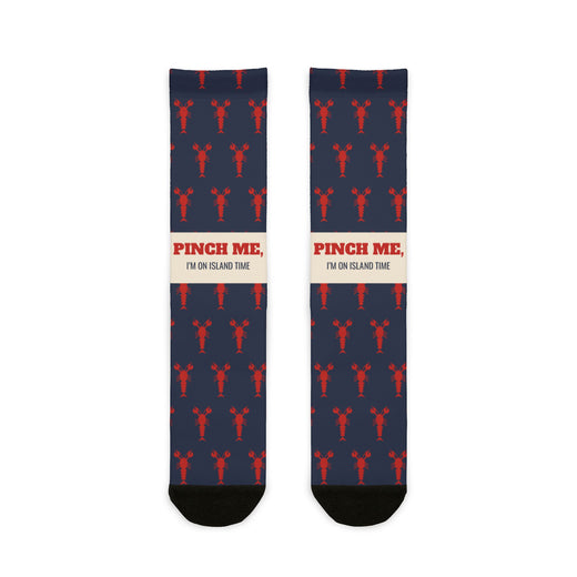 BlockBoundRI Pinch Me, I'm on Island Time lobster socks, navy with red lobsters and cream slogan band, front flat lay