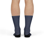 Front view of model standing in navy sailing crew socks with a white and gold compass rose