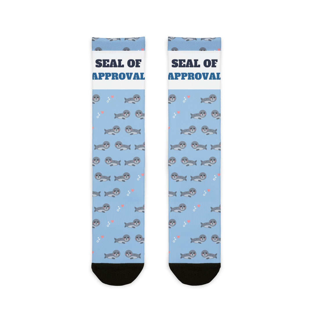 BlockBoundRI Seal of Approval Rhode Island socks, light blue with gray harbor seals and white slogan band, flat lay