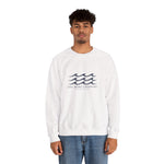 Man in jeans wearing the white One More Crossing Block Island crewneck sweatshirt, front view