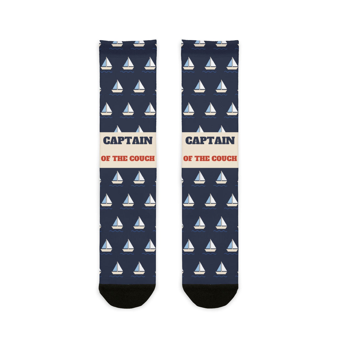 BlockBoundRI Captain of the Couch nautical crew socks, front flat lay of navy socks with white sailboats and cream band