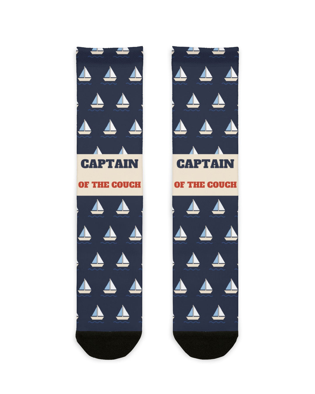 BlockBoundRI Captain of the Couch nautical crew socks, front flat lay of navy socks with white sailboats and cream band