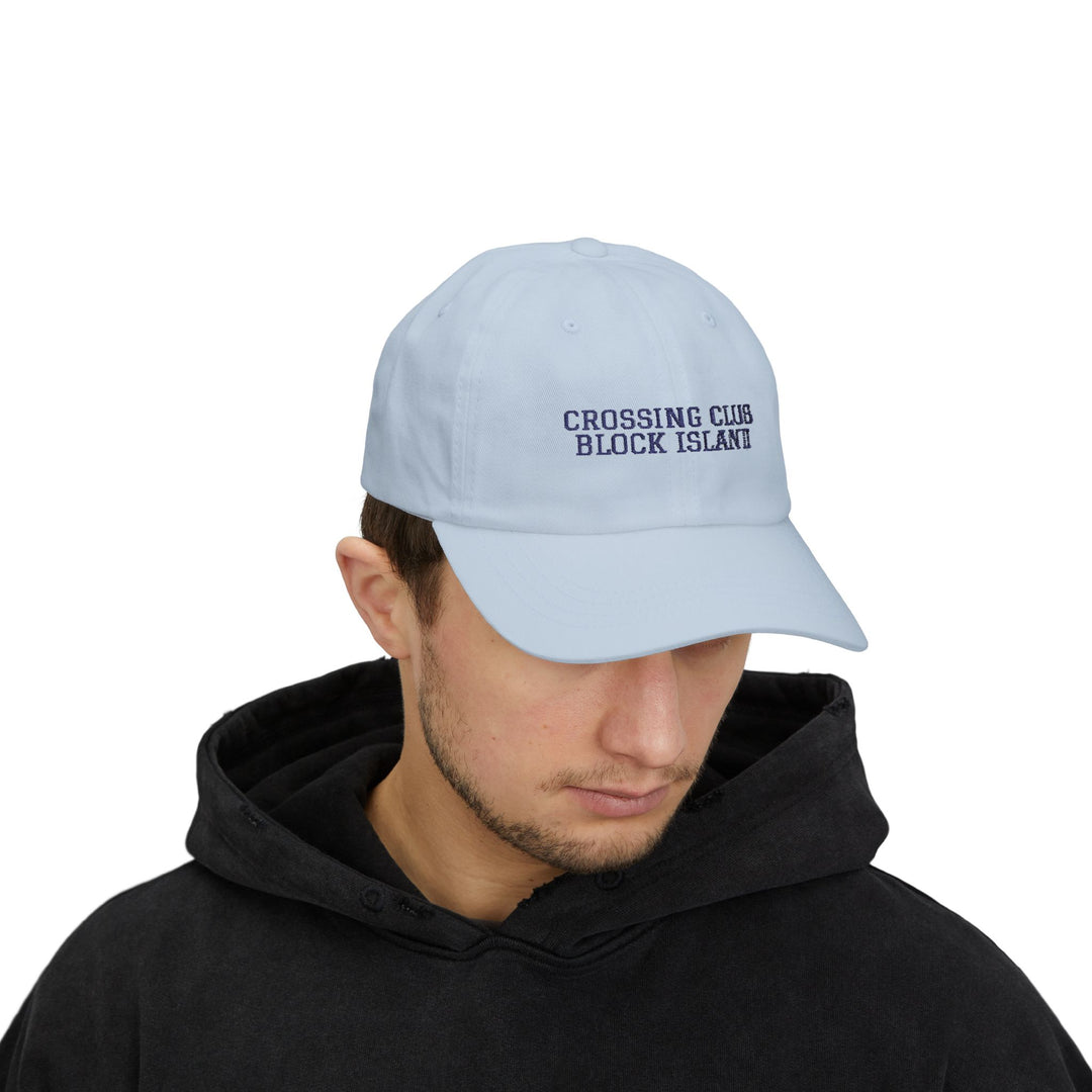 Man in a black hoodie wearing the Light Blue Crossing Club Block Island hat, front view