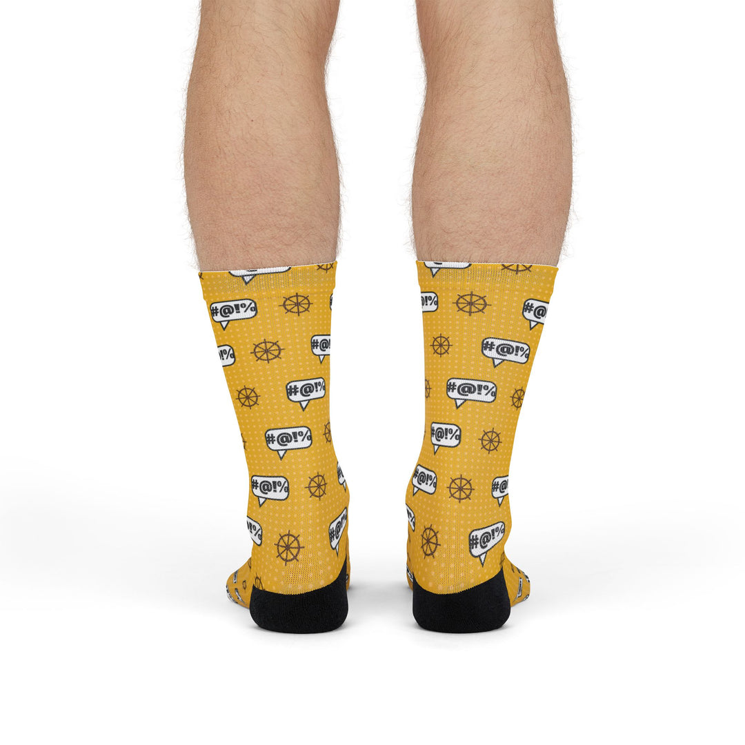 Front view of legs in yellow Swear Like a Sailor nautical crew socks with red band and cursing speech bubbles