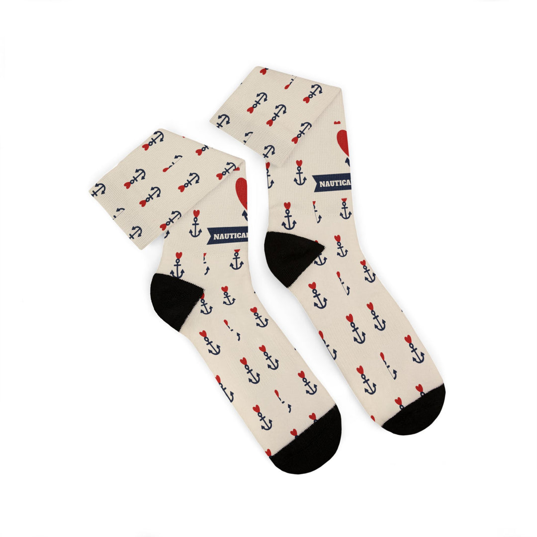 Folded pair of tan Nautical But Nice tattoo anchor socks with black heels, toes and navy anchor print