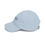 Side angle of the Light Blue Block Island hat showing Crossing Club embroidery and pre-curved bill