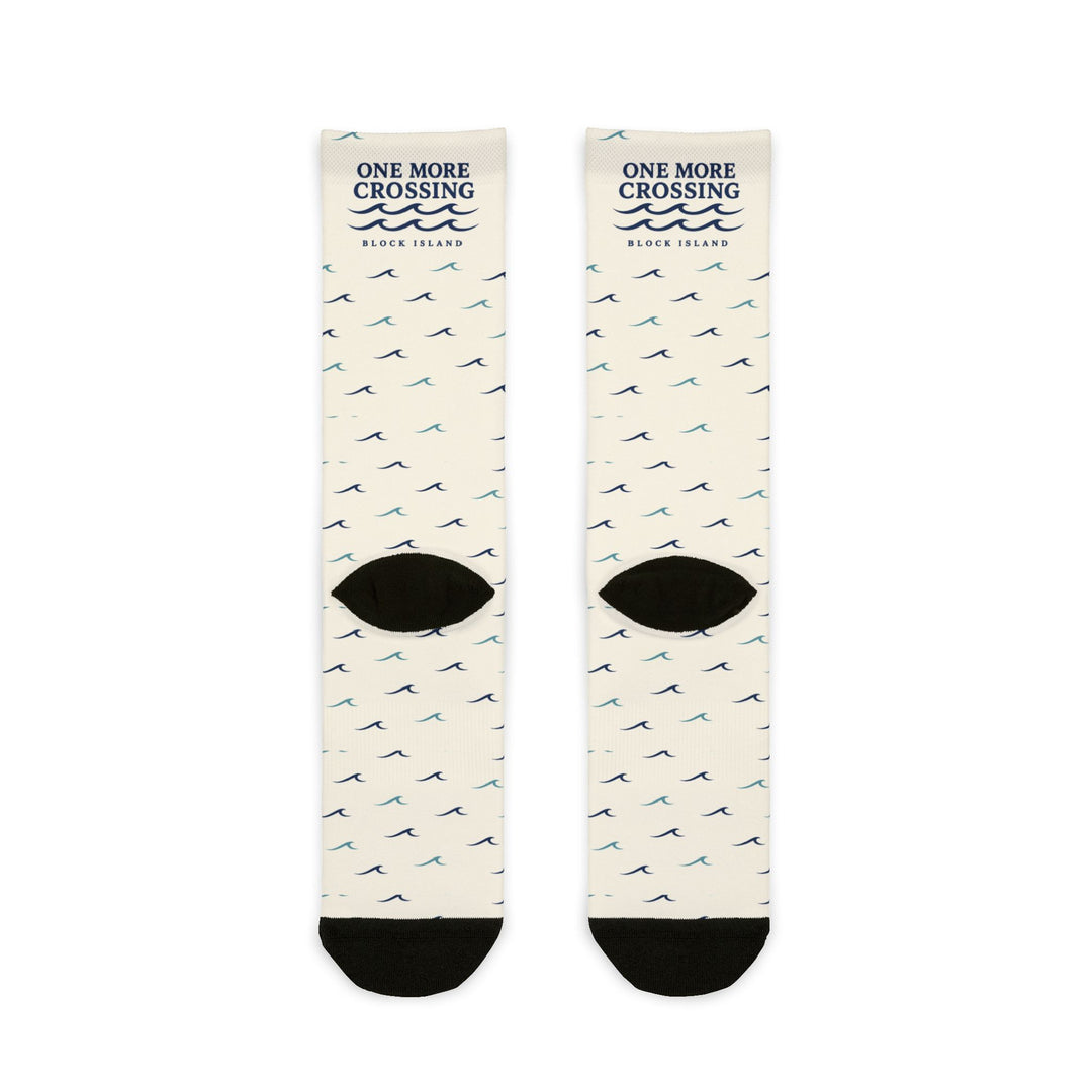 Back of off-white One More Crossing nautical crew socks flat lay showing wave pattern and black heels
