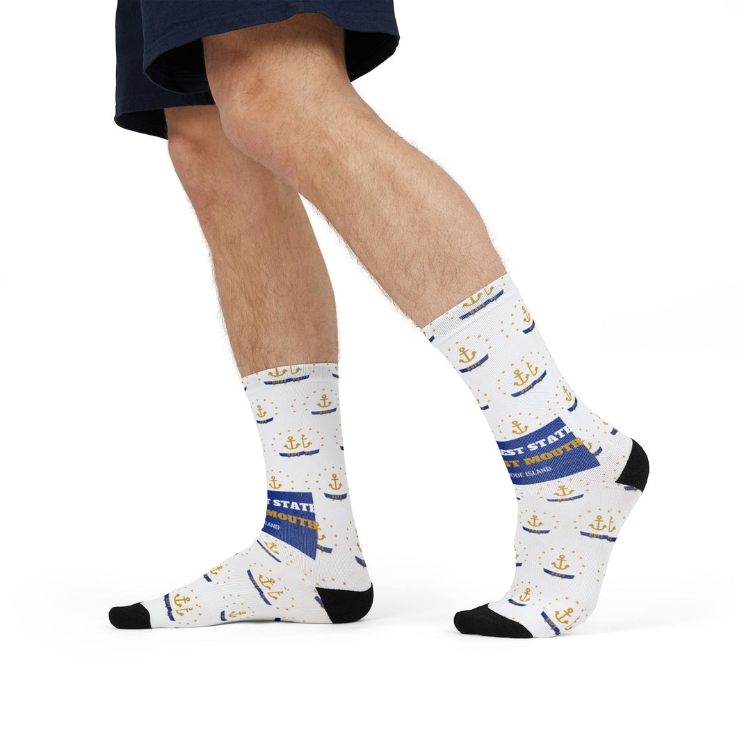 Model in shorts mid-stride wearing white nautical crew socks with gold anchors and a blue Rhode Island band