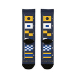 Back of the Block Island signal flag socks laid flat, navy with yellow, blue and checkered nautical flags
