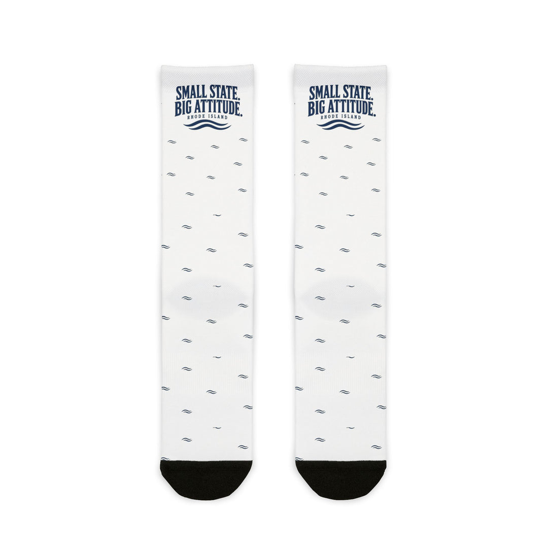 BlockBoundRI Small State. Big Attitude. Rhode Island socks flat lay, white with navy wave pattern and black toes
