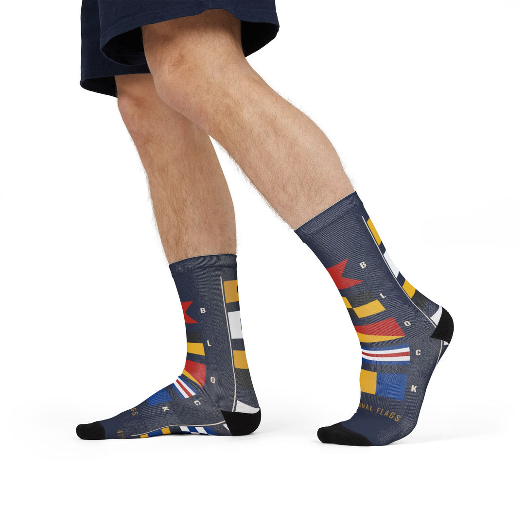 Side stride in navy Block Island signal flag socks showing the red, yellow and blue maritime flags