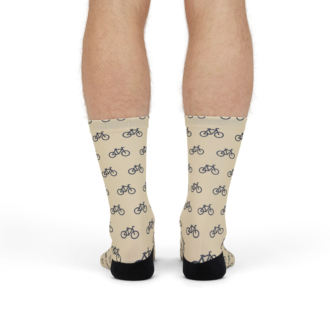 Model standing in cream My Legs Biked the Bluffs Rhode Island socks, back view with black heels