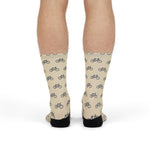 Model standing in cream My Legs Biked the Bluffs Rhode Island socks, back view with black heels