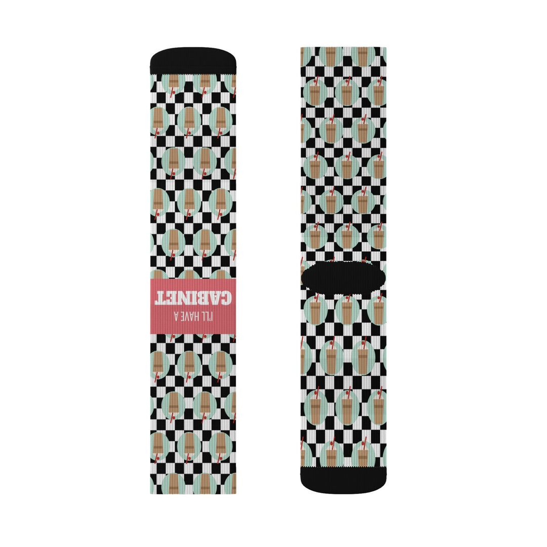 Upright pair of I'll Have a Cabinet Rhode Island socks laid flat, coral I'll Have a Cabinet band and black heel visible