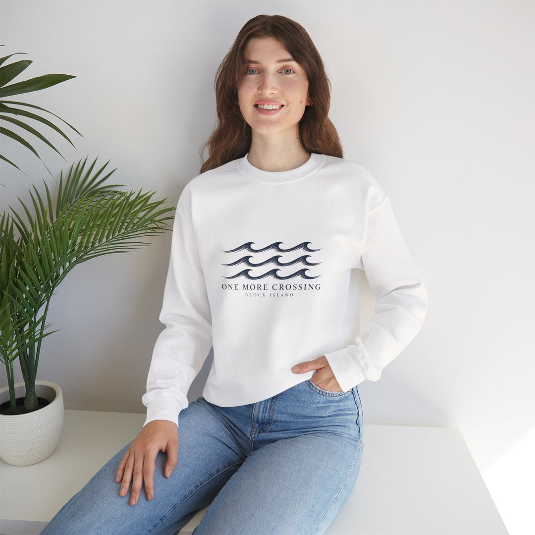 Woman seated beside a potted plant in the white One More Crossing Block Island sweatshirt with waves