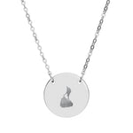 Round pendant necklace engraved with the outline of Block Island