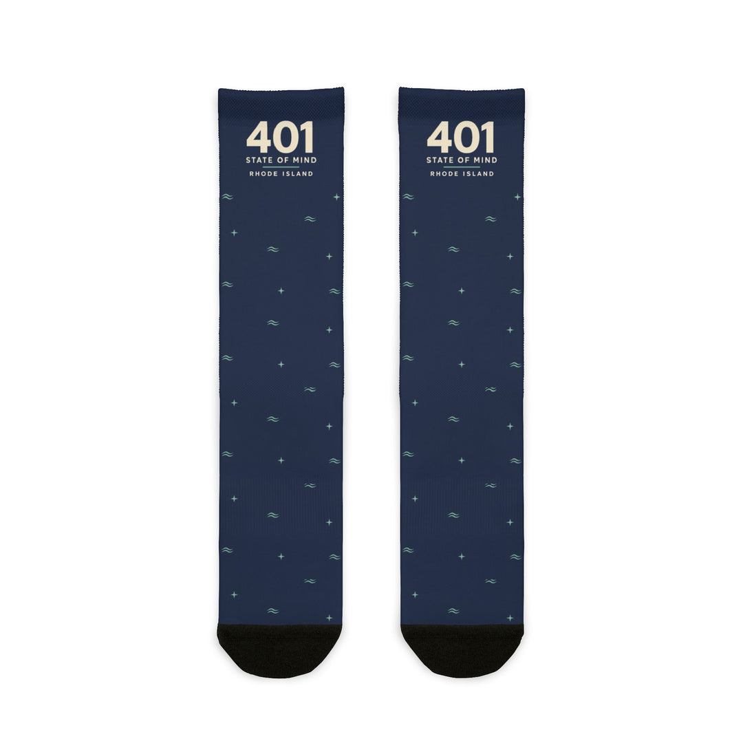 Flat lay of navy 401 State of Mind Rhode Island socks with cream 401 lettering and a scattered wave pattern