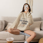 Woman lounging on a sofa in the sand Standby Line funny Block Island ferry crewneck