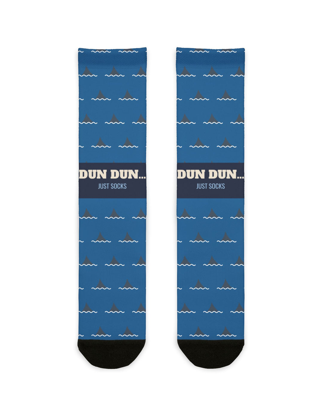 Dun Dun Shark Fin socks laid flat: blue crew socks with repeating shark fin print, DUN DUN band and black heel and toe