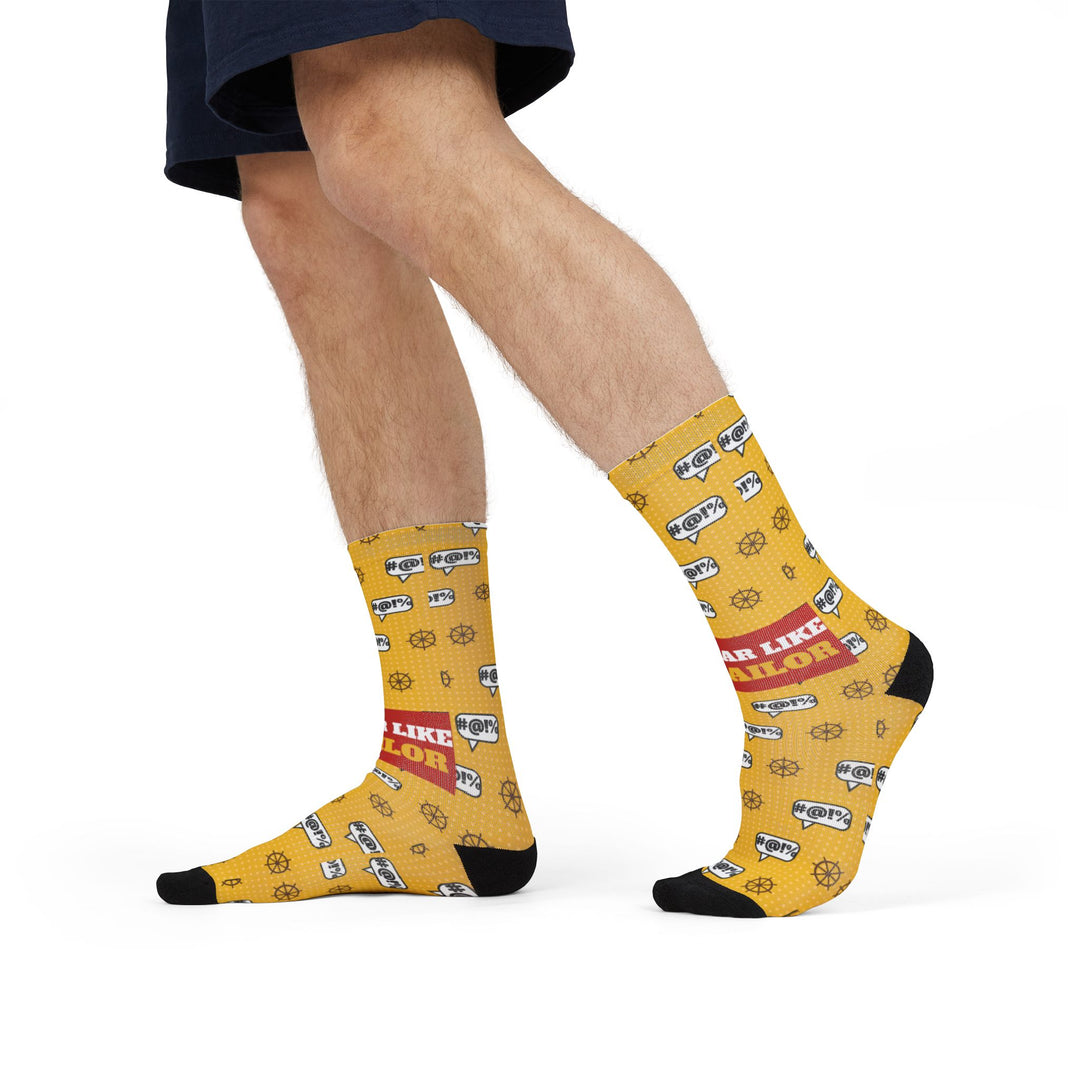 Model in shorts mid-stride wearing yellow Swear Like a Sailor funny beach socks with red slogan band