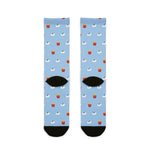 Back flat lay of light blue seagull socks with red french fry cartons, black heels and black toes
