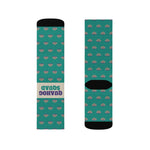 Flat lay pair of teal Rhode Island clam socks, black cuffs and toes framing the cream Quahog Squad slogan band