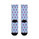Back of the light blue I'd Need 4 Pairs octopus crew socks laid flat, showing black heels and toes