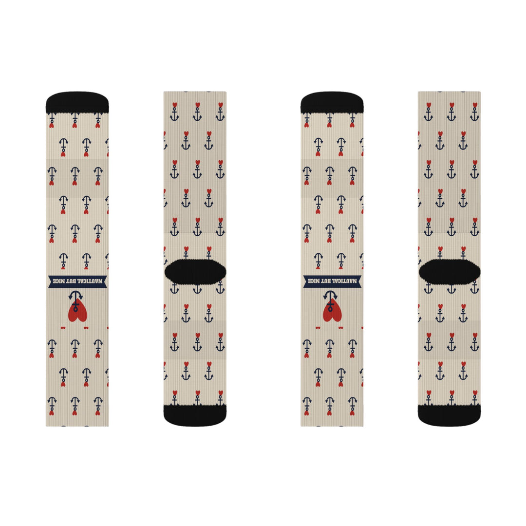 Front and back flat lay of two tan retro tattoo anchor socks pairs with red heart and navy banner