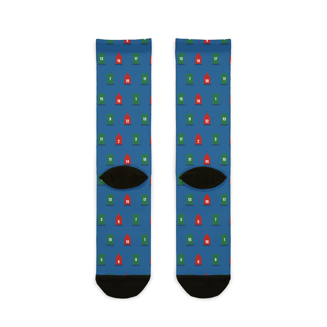 Back flat lay of blue boater socks dotted with red and green channel buoys, black heels and toes
