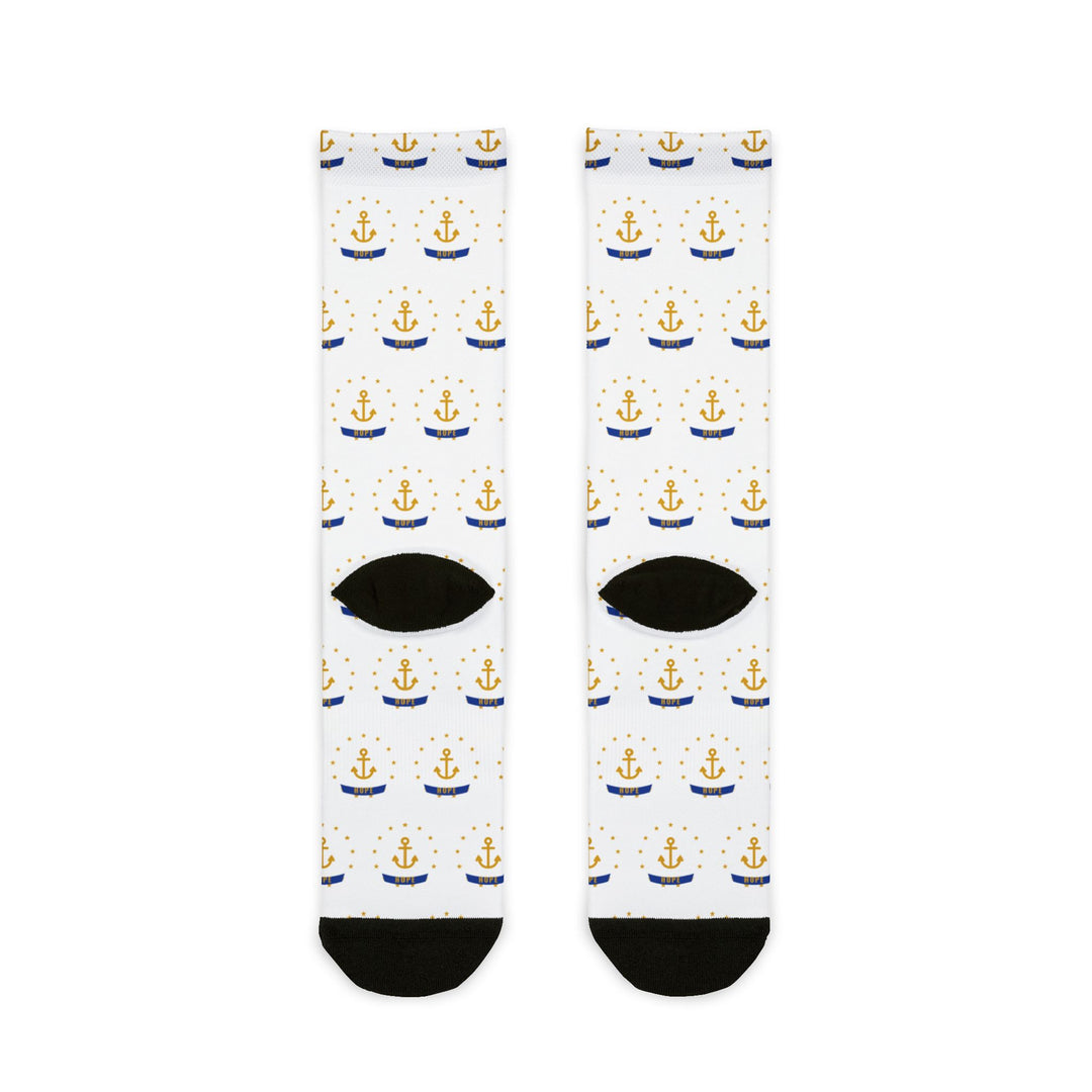 Back of the white Smallest State Biggest Mouth Rhode Island socks laid flat, gold anchor print and black heels