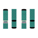 Third flat lay of Quahog Squad Rhode Island clam socks, four teal socks side by side with black toes and cream bands