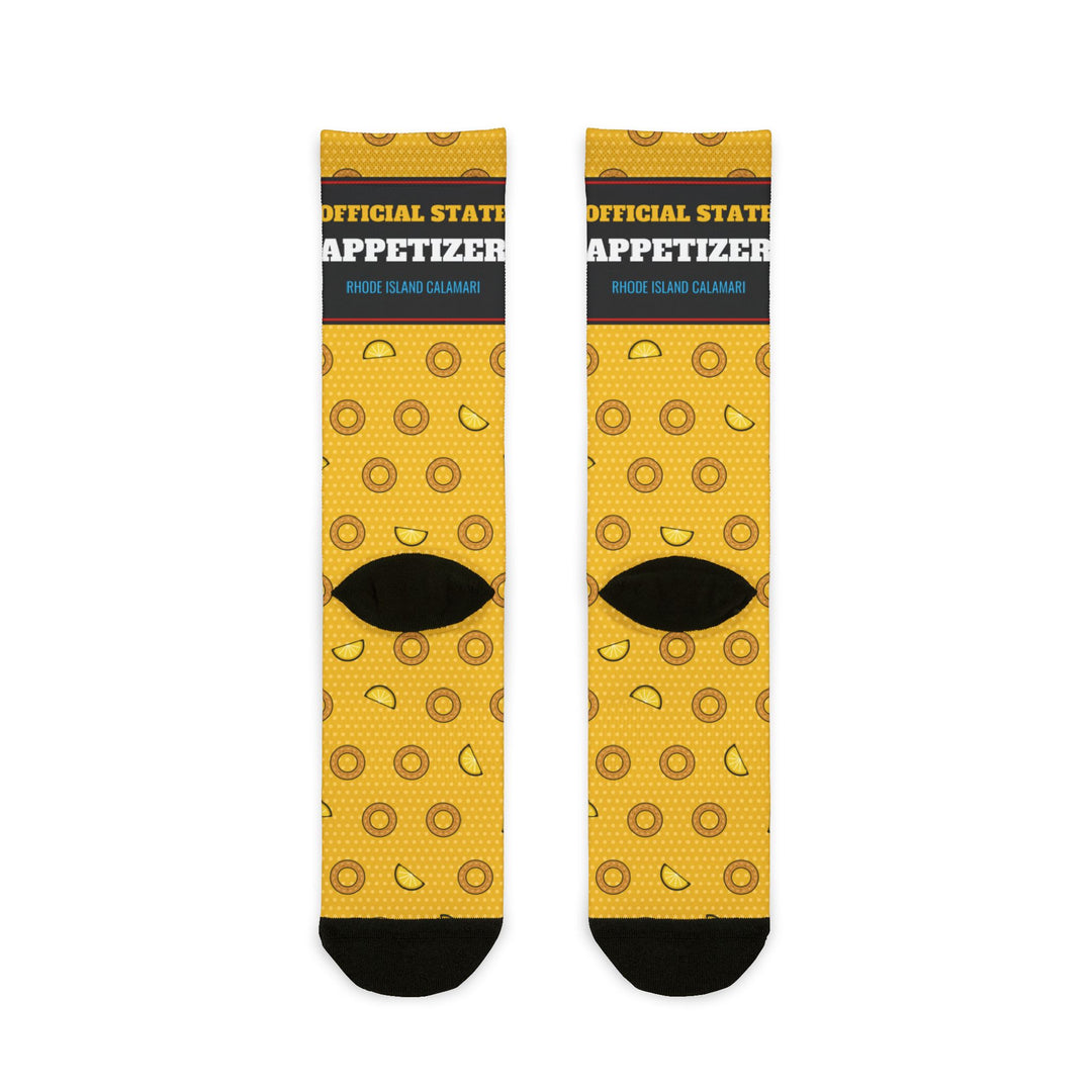 Back of yellow Squid Pro Quo crew socks showing the Official State Appetizer band and black heels, flat lay