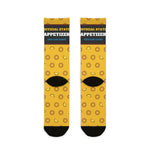Back of yellow Squid Pro Quo crew socks showing the Official State Appetizer band and black heels, flat lay