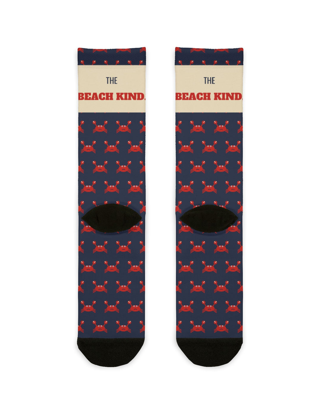 Back of I Got Crabs funny beach socks flat lay, navy with red crab pattern and black heels