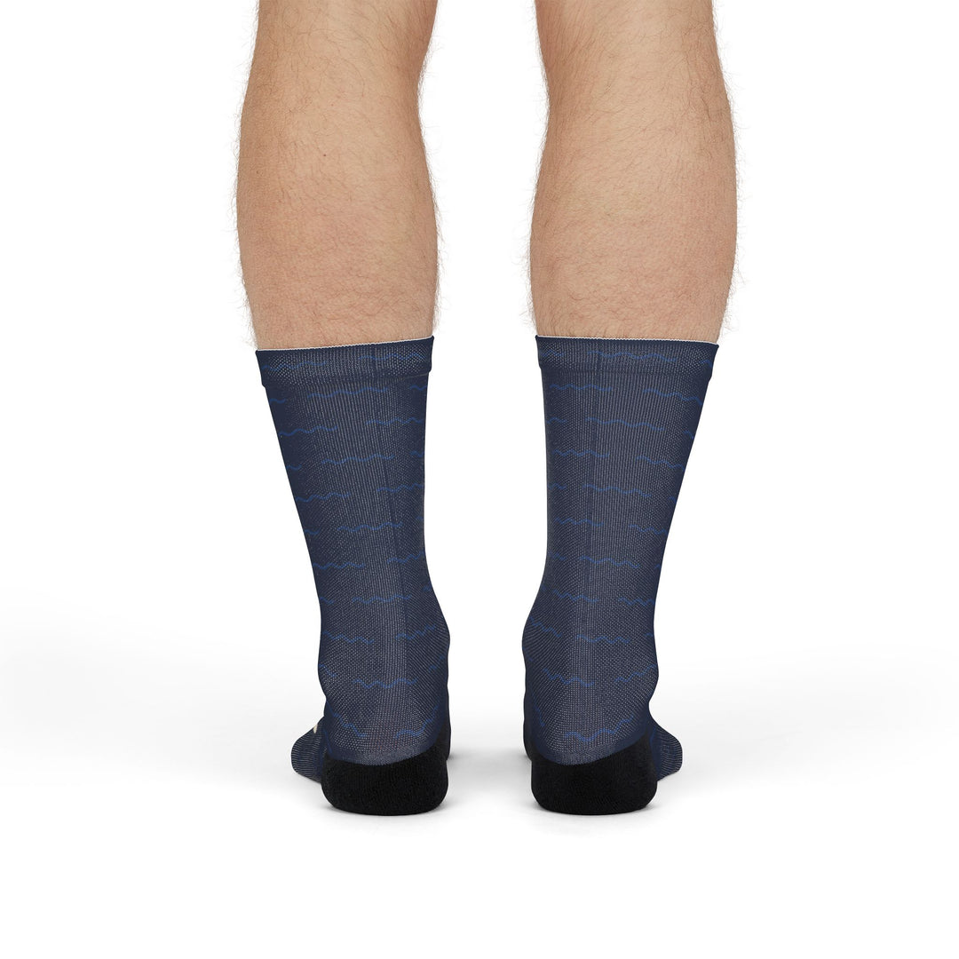 Front view of a model standing in navy Block Island map socks, a Block Island gift