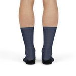 Front view of a model standing in navy Block Island map socks, a Block Island gift