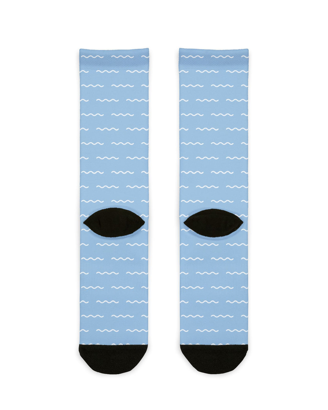 Back of light blue Block Island socks flat lay showing white dash pattern and black heels and toes