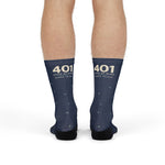 Front view of standing model in navy 401 State of Mind Rhode Island socks with cream 401 at the cuff