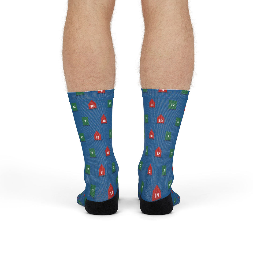 Front view of model standing in blue boating socks scattered with red and green navigation buoys