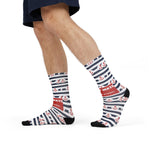 Model in shorts mid-stride showing the red First Mate band on striped anchor nautical crew socks