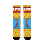 Squid Pro Quo funny Rhode Island socks in yellow with calamari rings, red slogan band and pink squid on blue, flat lay