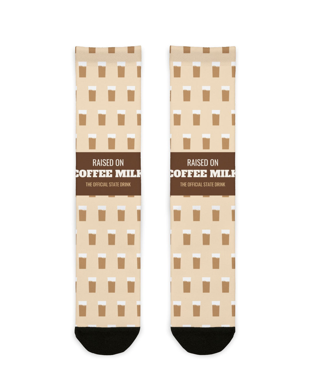 BlockBoundRI Raised on Coffee Milk Rhode Island socks, cream crew socks with brown band and coffee milk icons, flat lay