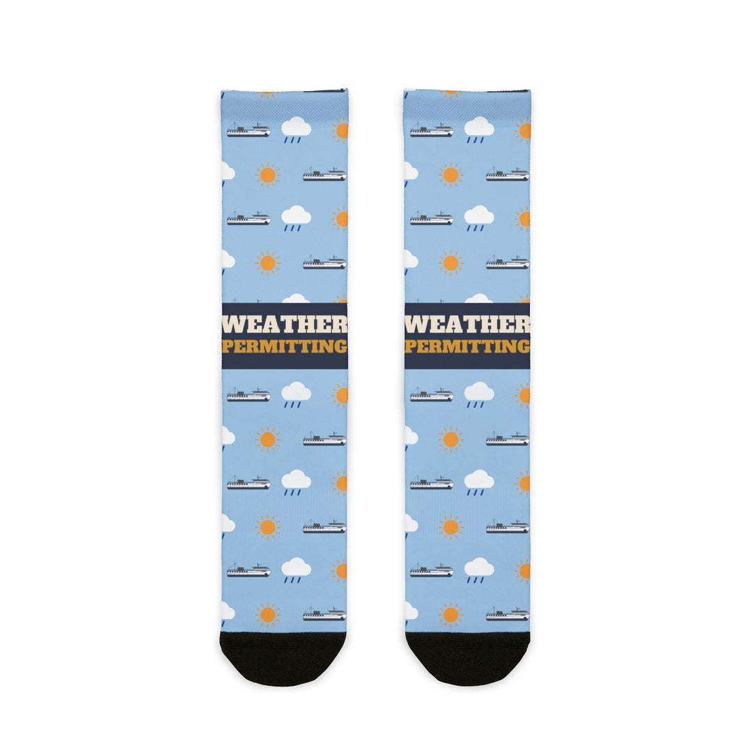 BlockBoundRI Weather Permitting Block Island socks, light blue with ferries, clouds and suns, front flat lay