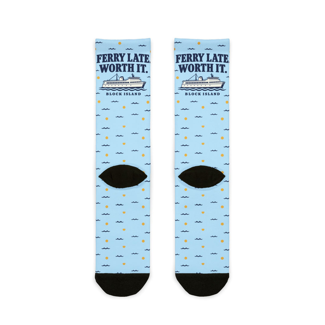 Back of the Ferry Late. Worth It. Block Island crew socks laid flat, showing black heels and light blue all-over print