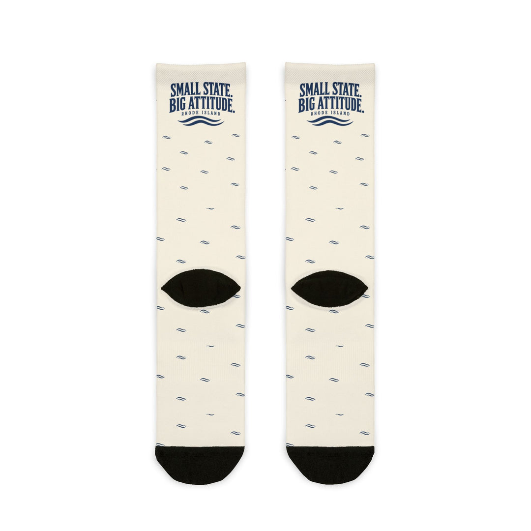 Back flat lay of white Small State. Big Attitude. Rhode Island crew socks showing black heels and navy waves