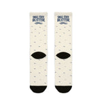 Back flat lay of white Small State. Big Attitude. Rhode Island crew socks showing black heels and navy waves