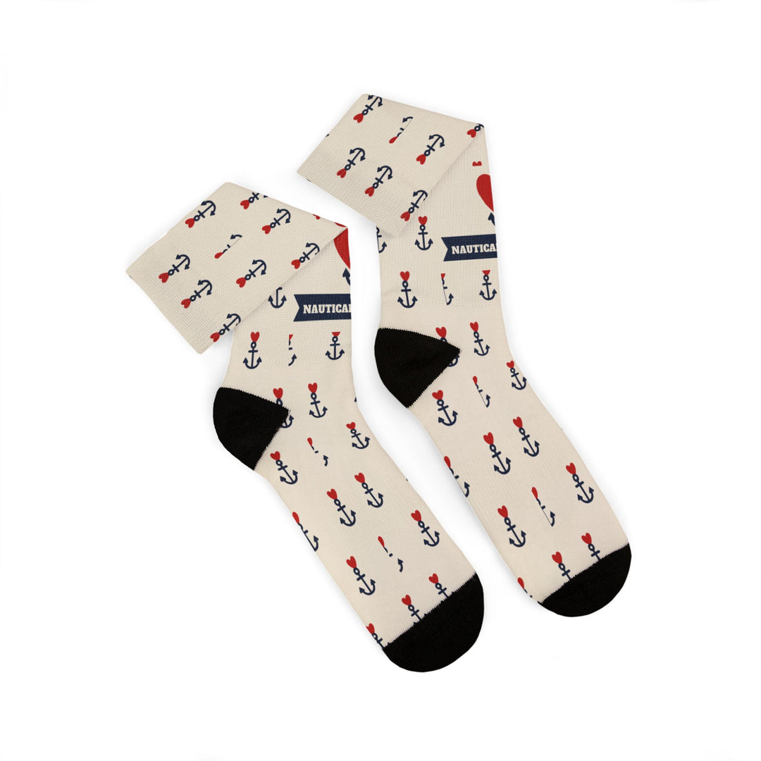 Folded tan sailor socks with old school tattoo anchors, red hearts and black cuffs, heels and toes